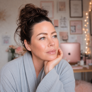 Jakolien Sok, founder of Jacky + Co., at her desk with her chin resting on her hand